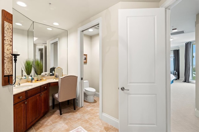 full bathroom featuring recessed lighting, toilet, ensuite bathroom, vanity, and baseboards