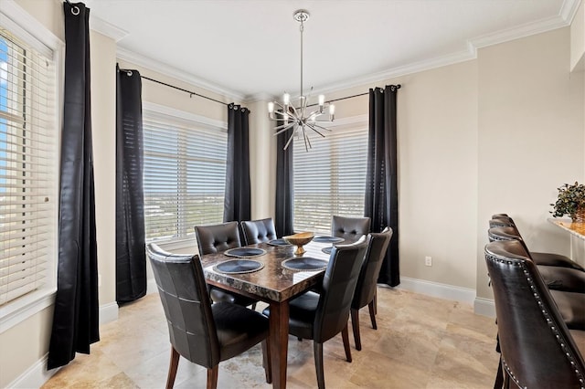 dining room featuring crown molding, baseboards, and a notable chandelier