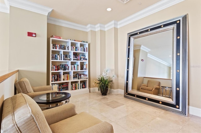 living area with ornamental molding and baseboards