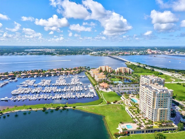 drone / aerial view featuring a water view and a city view