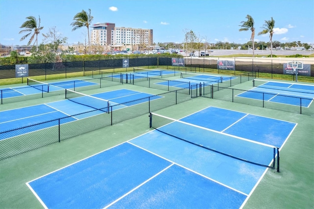 view of tennis court with fence