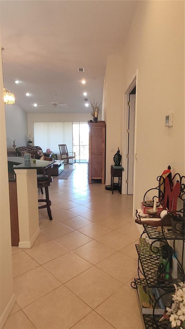 hallway featuring light tile patterned flooring