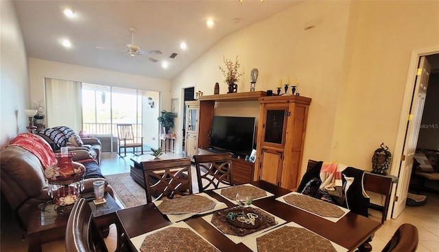 living room featuring ceiling fan, vaulted ceiling, and light tile patterned flooring