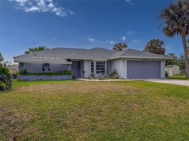 single story home featuring a garage and a front lawn