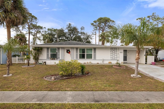 ranch-style home featuring a front yard and a carport