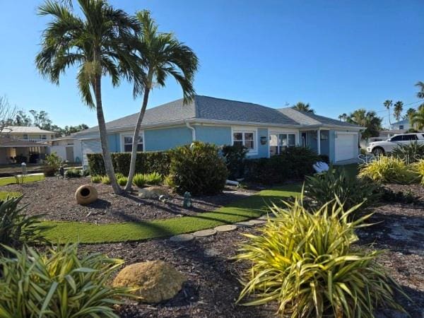 ranch-style home featuring a garage