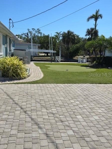 surrounding community featuring a yard