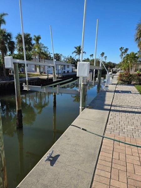 view of dock with a water view and boat lift