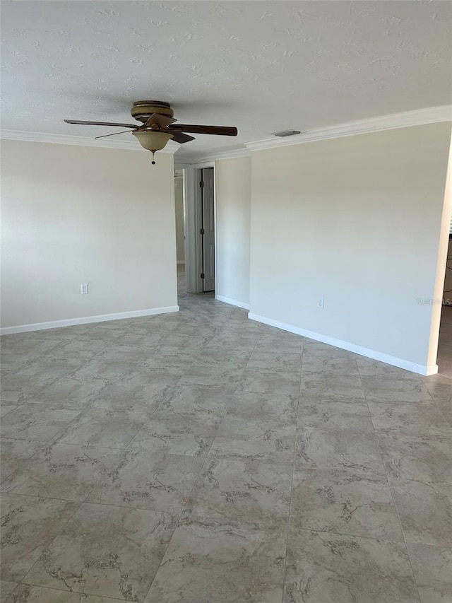 empty room featuring visible vents, ornamental molding, ceiling fan, and baseboards
