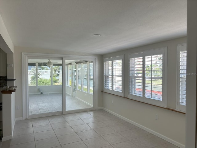 618 Jungle Queen Way, Longboat Key, FL 34228 - spare room with light tile patterned floors and baseboards