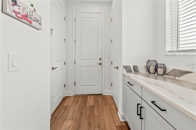 hallway featuring light wood-type flooring