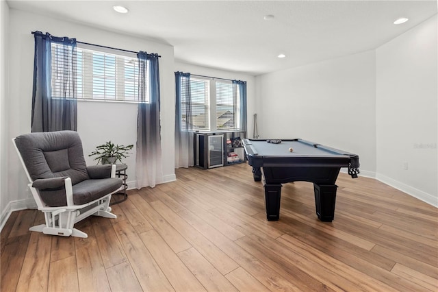 recreation room with light hardwood / wood-style floors and pool table