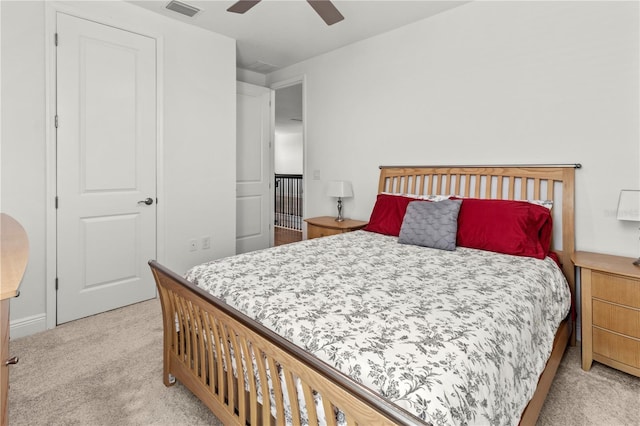 bedroom with ceiling fan and light colored carpet