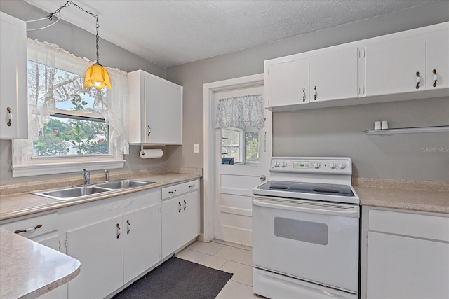 kitchen featuring white cabinets, decorative light fixtures, white range with electric stovetop, and sink