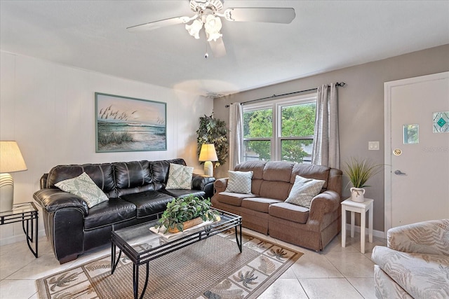 tiled living room with ceiling fan