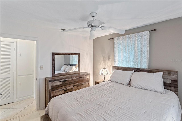 bedroom featuring ceiling fan and light tile patterned flooring