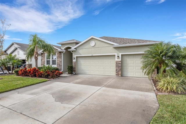 ranch-style house featuring a front lawn and a garage