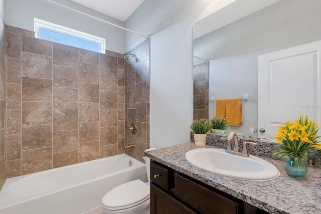 full bathroom featuring vanity, toilet, and tiled shower / bath