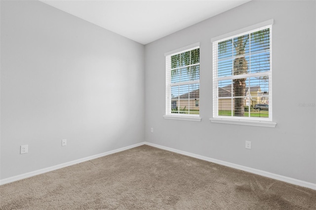 unfurnished room with carpet flooring