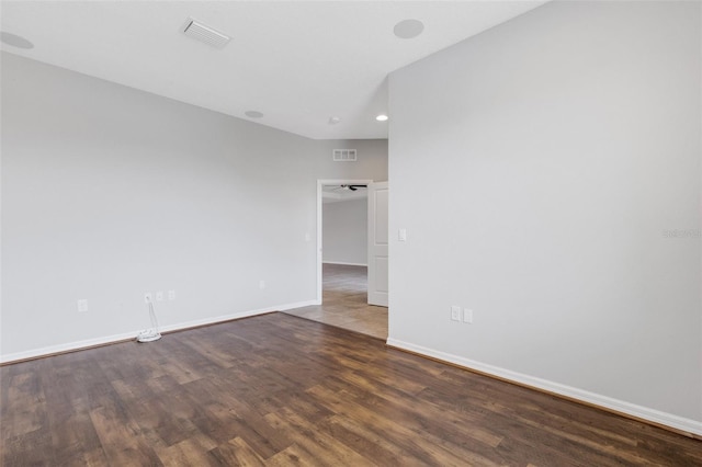 spare room with dark hardwood / wood-style floors