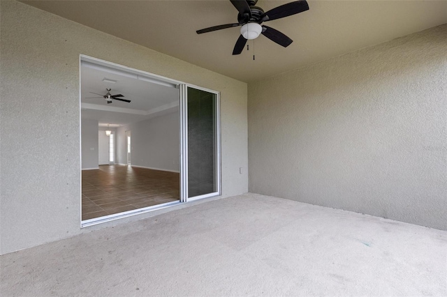 view of patio featuring ceiling fan