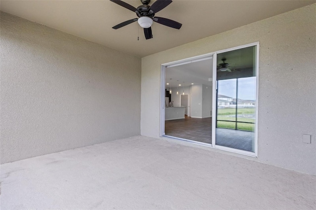 view of patio / terrace featuring ceiling fan