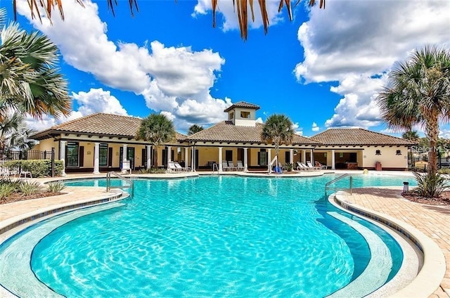 view of swimming pool featuring a patio area