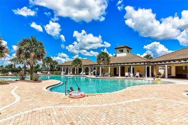 view of pool featuring a patio