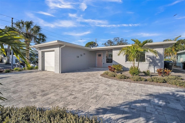 ranch-style home featuring a garage