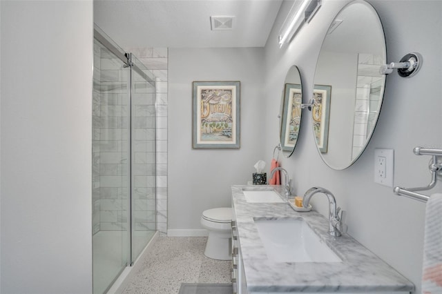 bathroom with vanity, toilet, and walk in shower