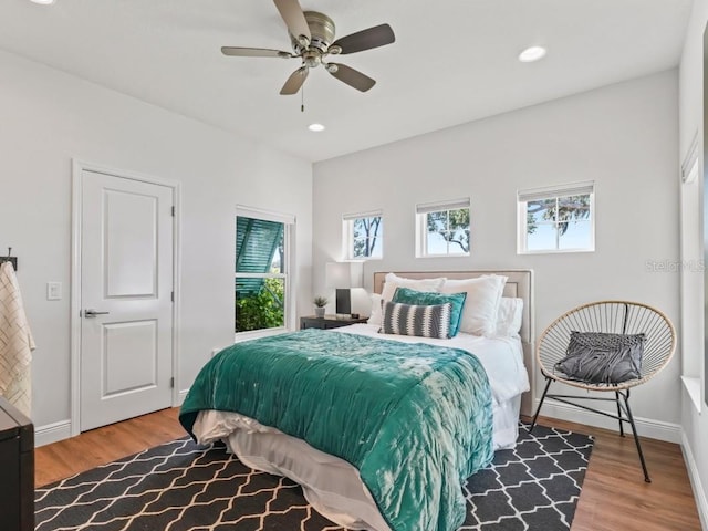 bedroom featuring ceiling fan and light hardwood / wood-style floors