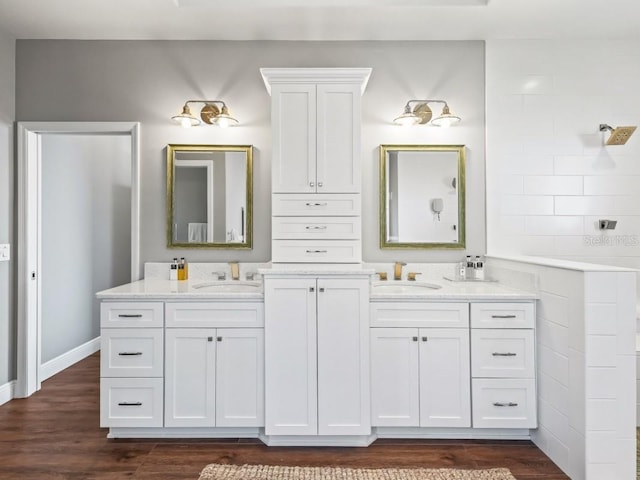 bathroom with vanity and wood-type flooring