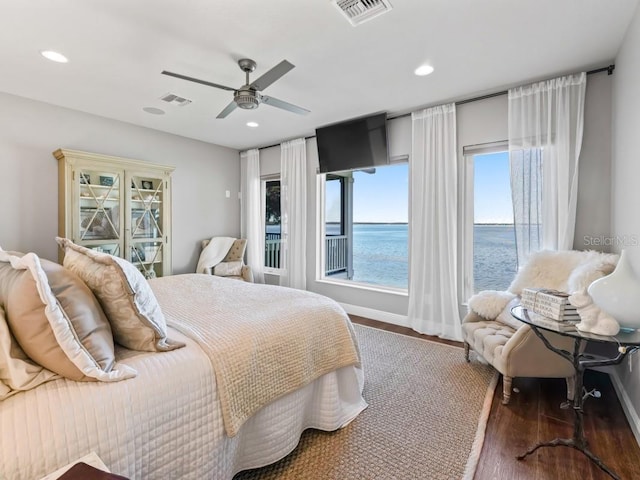 bedroom with ceiling fan and dark wood-type flooring