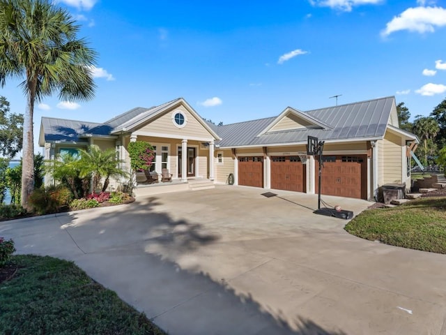 view of front of property with a porch and a garage