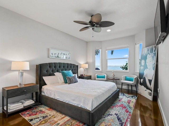 bedroom featuring ceiling fan and dark hardwood / wood-style flooring