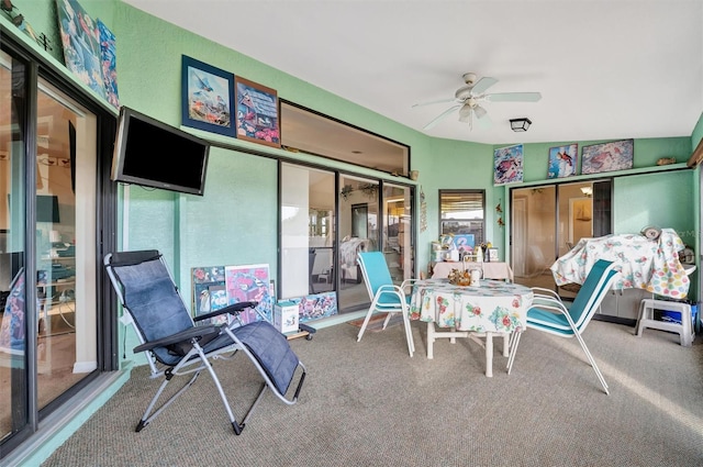 sunroom featuring vaulted ceiling and ceiling fan