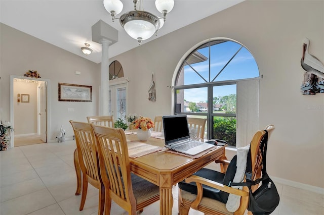 tiled dining space with lofted ceiling