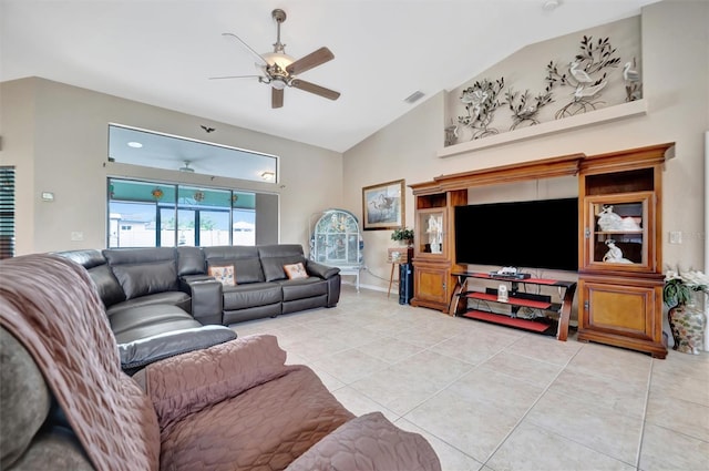 tiled living room with ceiling fan and vaulted ceiling