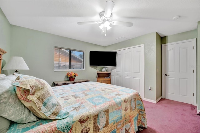 carpeted bedroom with ceiling fan and a closet