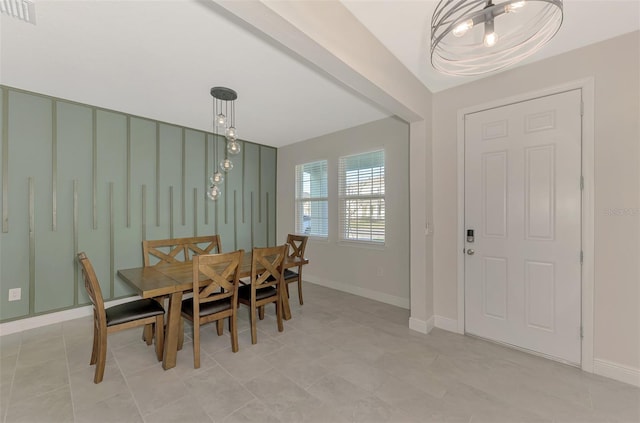 dining space with a notable chandelier