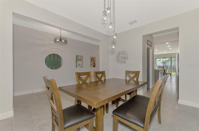 dining space featuring light tile patterned floors