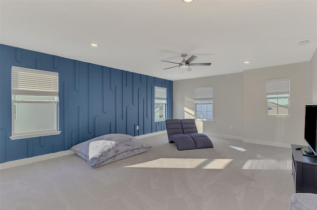 bedroom with light carpet and ceiling fan