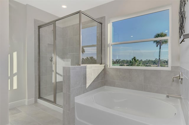 bathroom featuring separate shower and tub and tile patterned flooring