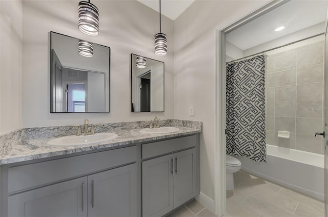 full bathroom with tile patterned floors, vanity, toilet, and shower / tub combo