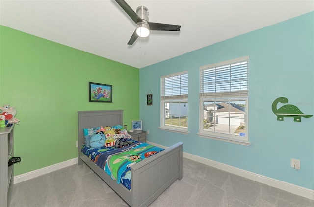 bedroom featuring light carpet and ceiling fan