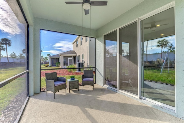 sunroom / solarium with ceiling fan