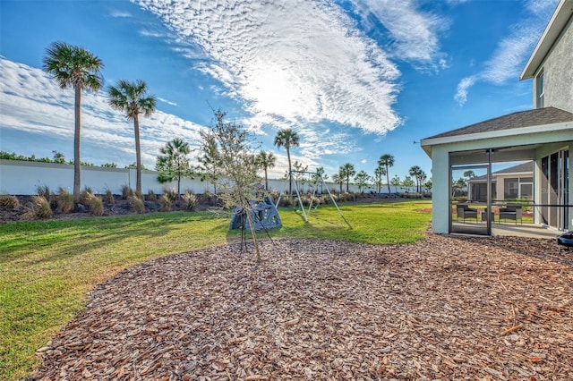 view of yard with a sunroom