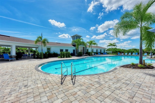 view of swimming pool featuring a patio