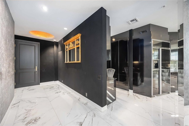 interior space featuring baseboards, marble finish floor, visible vents, and recessed lighting