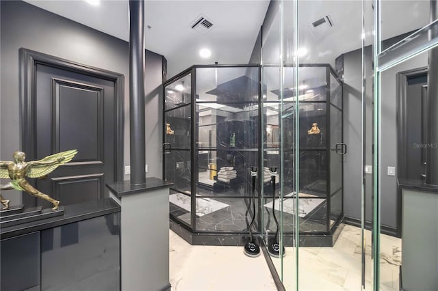 wine room featuring marble finish floor and visible vents